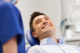 Smiling man in dental chair